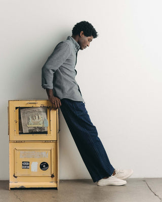 fit model posing in The Mariner Jean in Rinsed Indigo Dobby Denim, Bottoms by Taylor Stitch